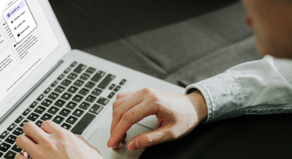 Person using a laptop with AI Chat interface for generating social media content.